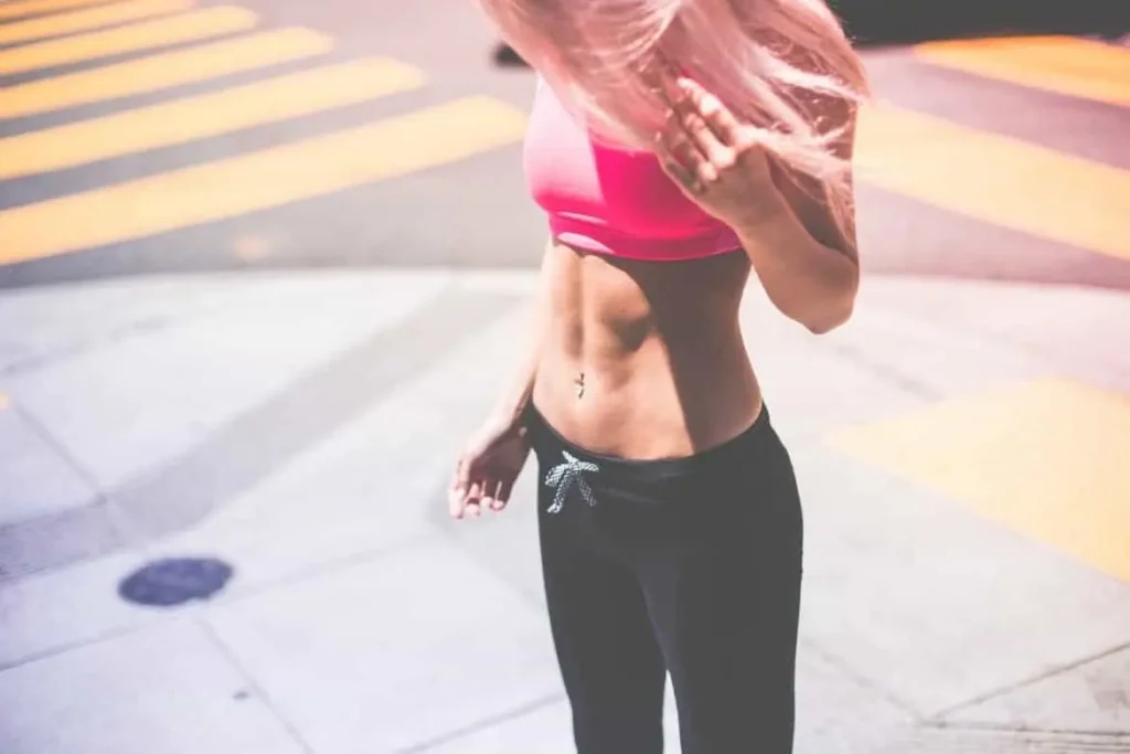 Woman with toned stomach after LA-EMS Body Sculpting Treatment Dorchester